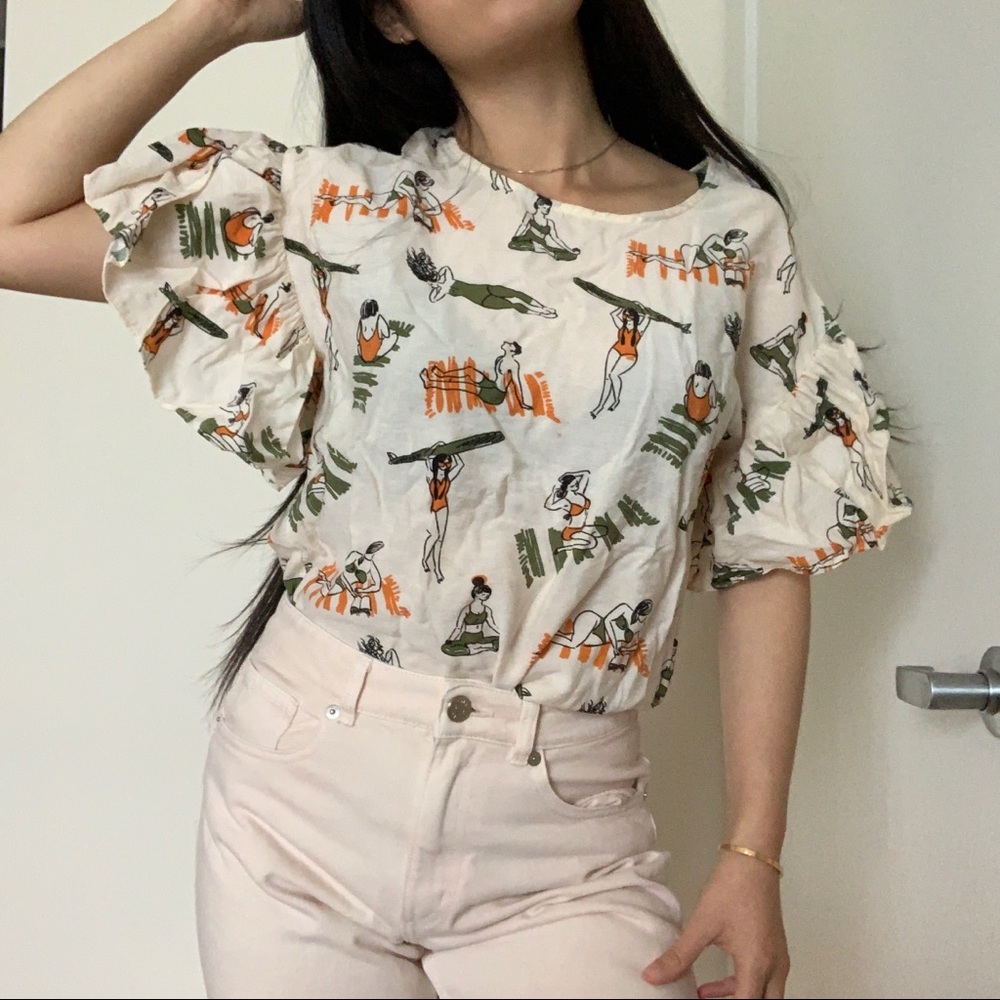 cute tshirt with ruffle sleeves, printed with sunbathers, surfers, and yogis